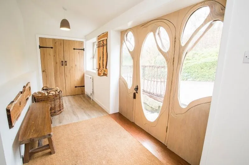 The hallway and carved oak front door
