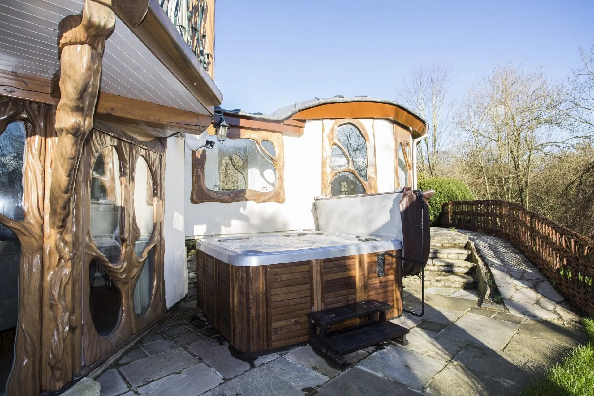 Private hot tub in the sheltered garden at Hunter's Moon