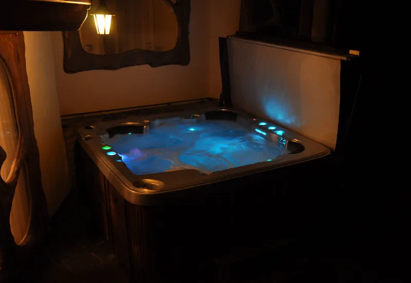 The hot tub lit up at night