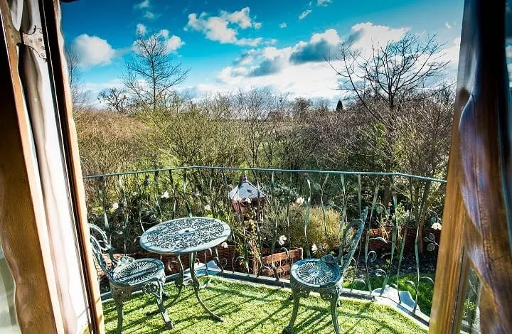 The cocktail balcony with table and chairs
